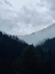 Misty mountain peaks with layered ridges at dawn