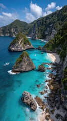 Obraz premium Aerial view of a tropical coastline with turquoise water, rocky outcrops covered in greenery, and a sandy beach under a partly cloudy sky