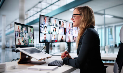 Executive Woman Using Laptop In Virtual Conference