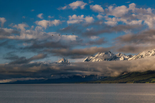 Morning View of Mountains Hidden behind Low Clouds