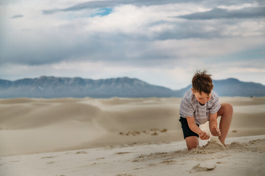 Boy Building Sand Castle in White Sands National Park