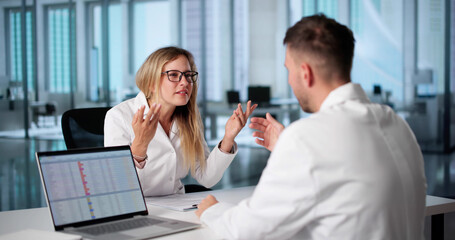 Fototapeta premium Doctors Argue Over Medical Decisions In Hospital Meeting