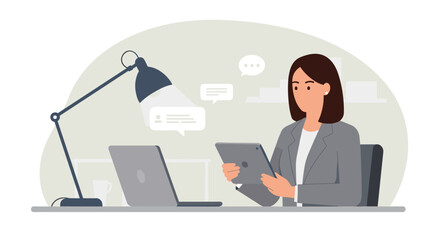 Professional woman in office setting with digital tablet and laptop interaction