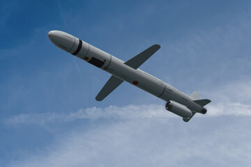 A modern Russian winged rocket in motion against the backdrop of the sky.