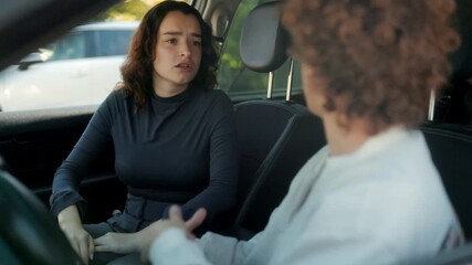 Young couple yelling in car during heated relationship argument - Powered by Adobe