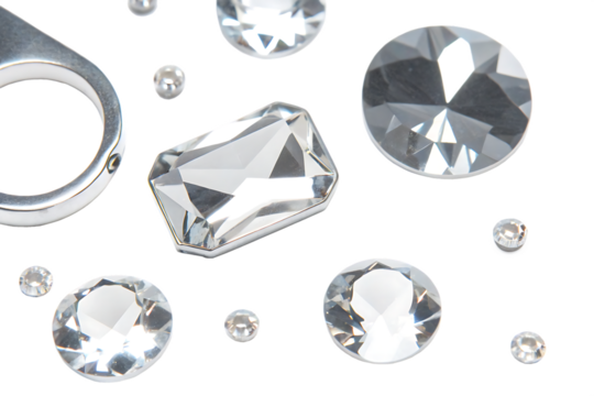 Clear faceted gems and metal ring isolated on a transparent background diamonds rhinestones