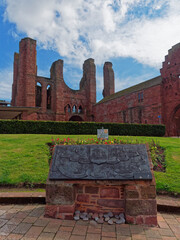 The Bronze Information Plaque in front of the West Front of Arbroath Abbey depicting the Towns rich history unveiled in 2019.