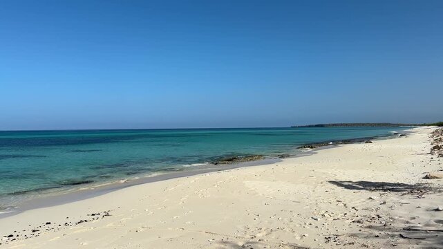 Beautiful, deserted beach of Playa de la Cueva, Cabo Rojo, Dominican Republic, near the border with Haiti. Tranquil, crystal clear, turquoise Caribbean sea. Peaceful vacation, nobody. Horizontal video