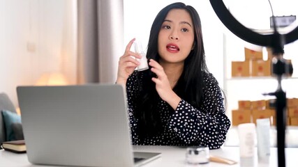 Asian woman influencer review product. Content creator social media communication. Marketing merchandise e-business. Online shopping lifestyle. Live review interview. Entrepreneur e-commerce. - Powered by Adobe