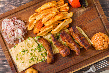 Grilled lamb fillet or Lamb Kusleme served with fries, lavash bread and bulgur pilaf
