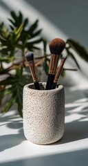 Makeup brushes in a speckled container