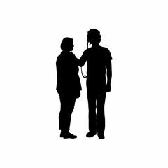 Silhouette of a smiling healthcare technician listening to a patient