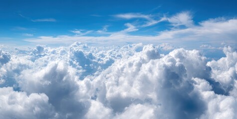 High-altitude view of puffy white clouds against a vibrant blue sky (3)