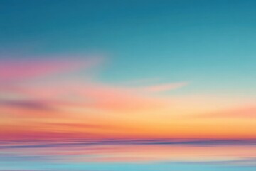 Fototapeta premium Blurry sunset over still water. Soft colors blend seamlessly in a serene scene