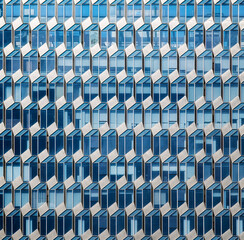 Obraz premium Modern abstract facade of a glass building in Chongqing, China