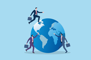 Businessmen climbing and reaching for the globe representing global business and international opportunities
