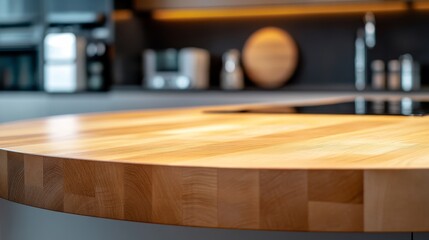 14.A round wood tabletop counter in the heart of a modern kitchen, reflecting the soft, warm light. The natural wood surface adds an organic touch to the minimalist, modern kitchen design, with sleek