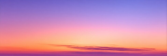 Soft sunset colors blend across a hazy sky