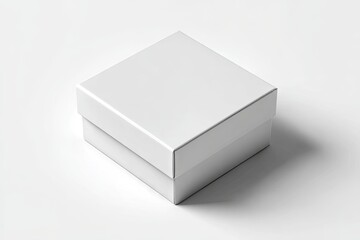 Fototapeta premium A plain, square, white cardboard box sits on a white background, casting a subtle shadow. Its lid is closed