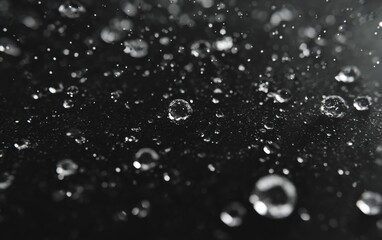 Close-up of water droplets on dark surface (1)