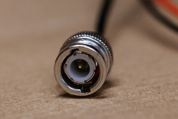 Macro photo of BNC connector. Metal connector with central contact, used for coaxial cables in video communication and radio equipment. BNC connector crimping.