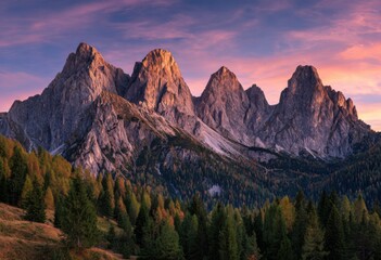 Mountain peaks bathed in vibrant sunset hues.  Forests of conifers and deciduous trees at base
