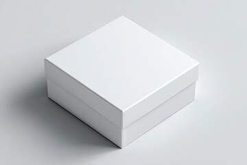 Fototapeta premium A pristine white square box sits on a light gray surface, casting a subtle shadow, suggesting a simple, elegant packaging design