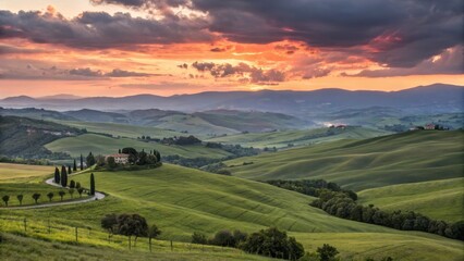 Naklejka premium Tuscany landscape at sunset with rolling green hills