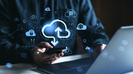 Cloud storage concept with digital upload and download icons over smartphone and laptop on dark background representing online data synchronization.