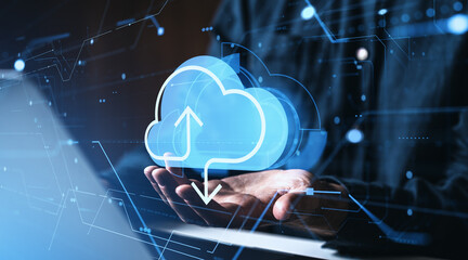 Cloud storage concept with glowing upload and download icons hovering above hands on digital interface background in blue tone.