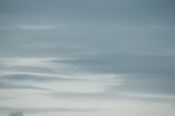 pastel blue background, in the photo blue gray sky