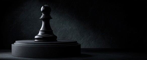The black pawn standing alone in dramatic spotlight on a dark background.