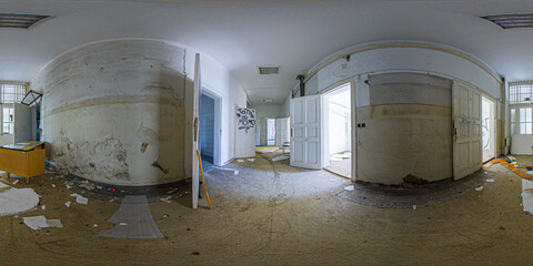 Panoramic view of an abandoned clinic interior with ornate ceiling details, broken furniture, and...