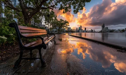 Keuken achterwand Reflectie City park bench at sunset, reflected in puddles  © logitech