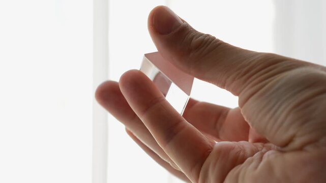 Crystallized prism in hands