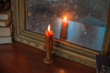 Decoration with orange candles and other stuff. October evening cozy time