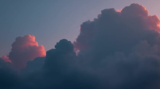 Dark cumulus obscures pink clouds illuminated