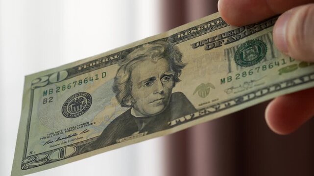 close up of american money.
Finance and business.
American cash in the hands of an american guy