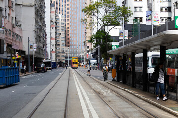 View landscape building skyscraper cityscape house of HongKong city and life lifestyle local chinese people on street with classic vintage retro tram traffic road on April 26, 2025 in Hong Kong, China