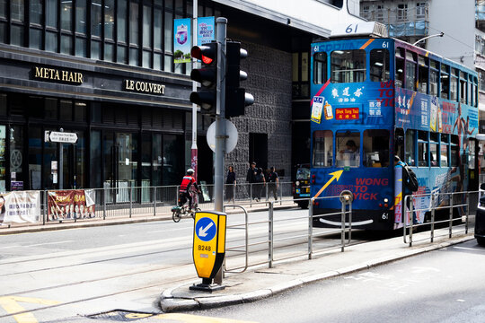View landscape building skyscraper cityscape house of HongKong city and life lifestyle local chinese people on street with classic vintage retro tram traffic road on April 26, 2025 in Hong Kong, China