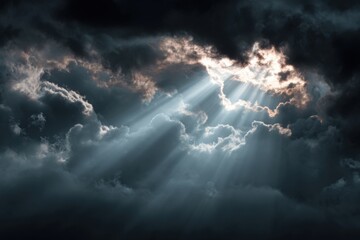 Dramatic sky, sunbeams piercing dark clouds