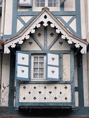Whimsical European Window with Playing Card Suit Decorations