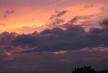 Fototapeta premium Fiery Sunset Sky with Clouds