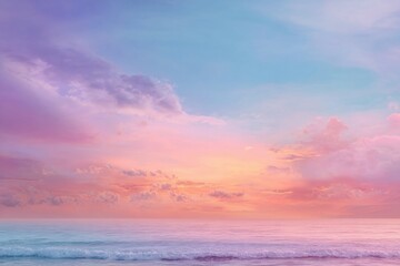 Pastel sunset over a tranquil ocean.  Soft, vibrant hues of pink, purple, and blue paint the sky and waves.  A gentle breeze creates small ripples on the water's surface