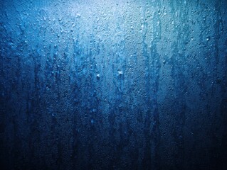 Close-up of a wet, textured surface.  Blue hues, droplets and streaks