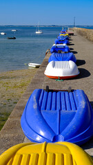 Row of small boats at Port of Orange at Quiberon at low tide in the Morbihan department in Brittany region in north-western France