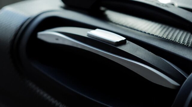 Suitcase for travel and tourism on long distances close-up.
Hand luggage at the airport.
Large and roomy gray travel bag