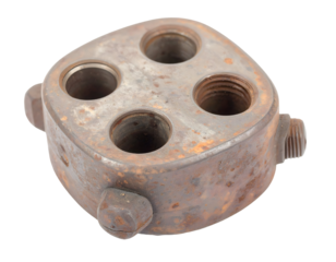 Rusty Metal Object with Four Holes and Threaded Fittings
