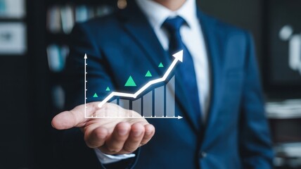 Businessman holding a glowing upward trending financial graph with rising stock market arrow in his palm