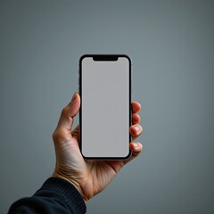 Close-Up View of Hand Holding a Blank Smartphone in Modern Minimalist Style Background